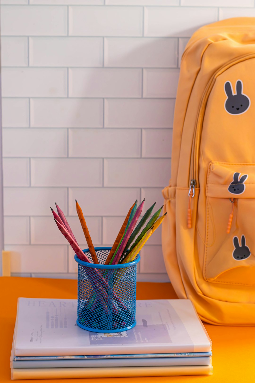 my-path a-yellow-backpack-sitting-on-top-of-a-table-c7eqtdkinpc