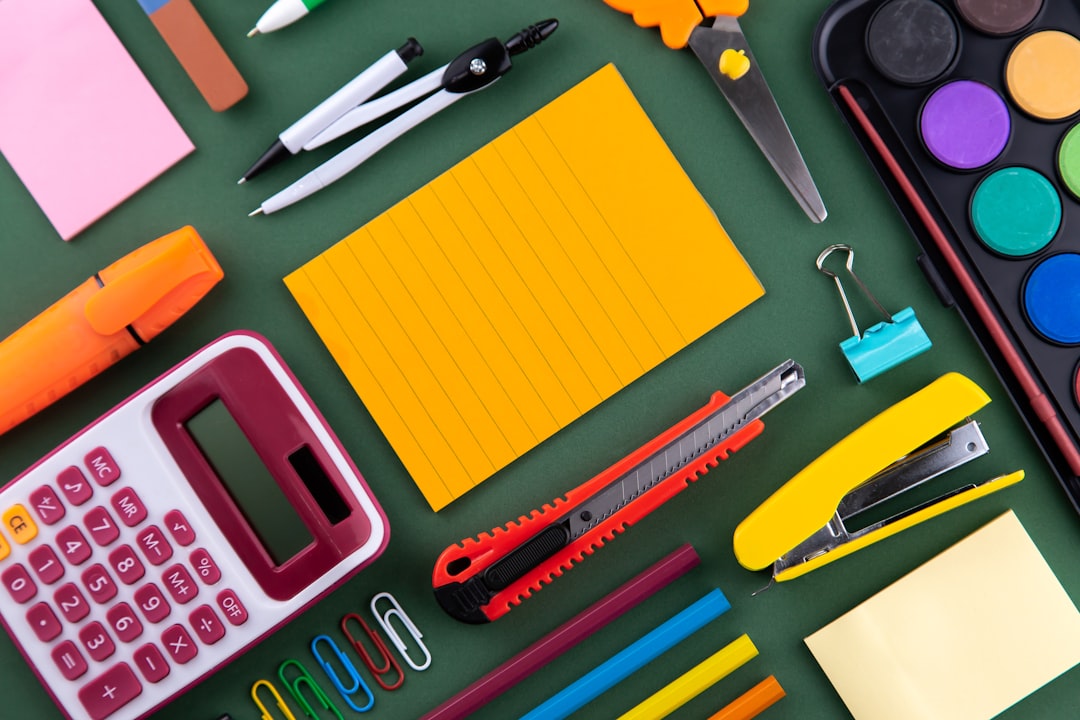 services-02 School office supplies stationery on a purple background desk with copy space. Back to school concept.