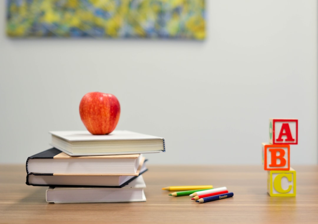 my-qualifications red-apple-fruit-on-four-pyle-books-oycl7y4y0bk